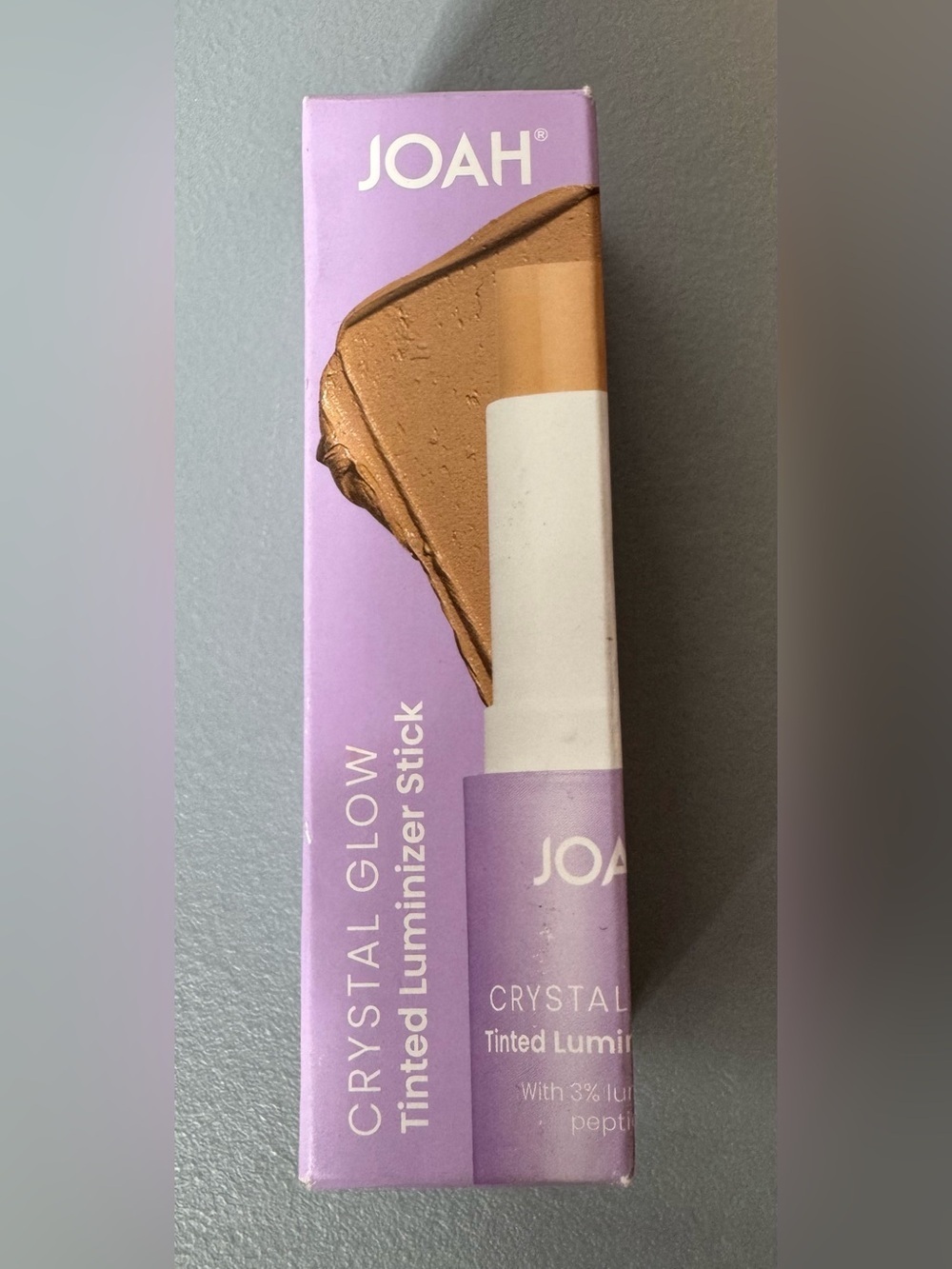 J.O.A.H Crystal Glow Tinted Luminizer Stick in MW020